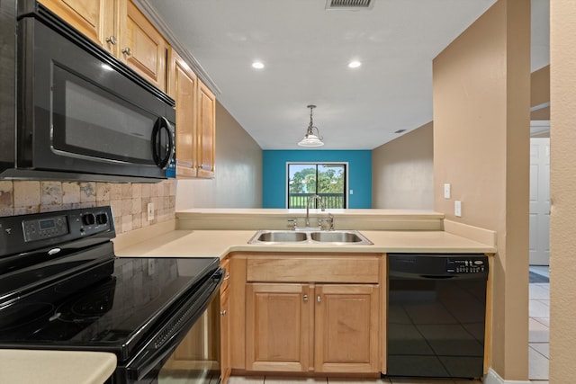 kitchen featuring sink, kitchen peninsula, decorative backsplash, light tile patterned floors, and black appliances