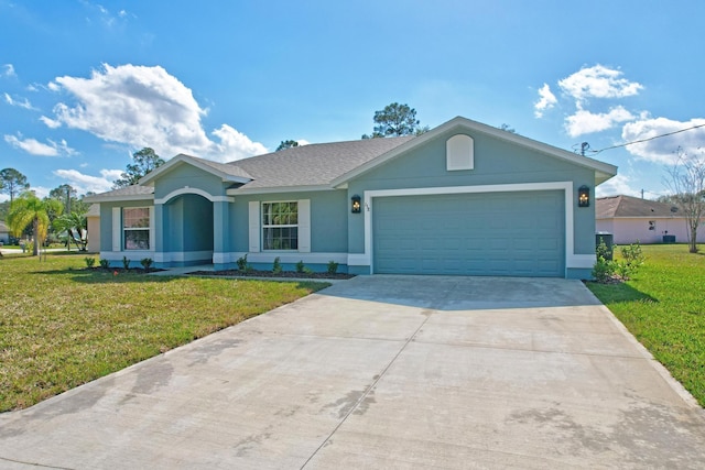 single story home featuring a garage and a front lawn