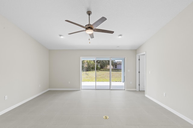 unfurnished room with a textured ceiling and ceiling fan