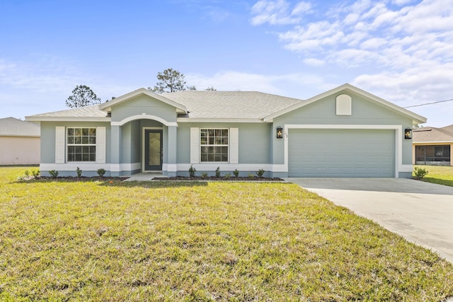 ranch-style house featuring a garage and a front lawn