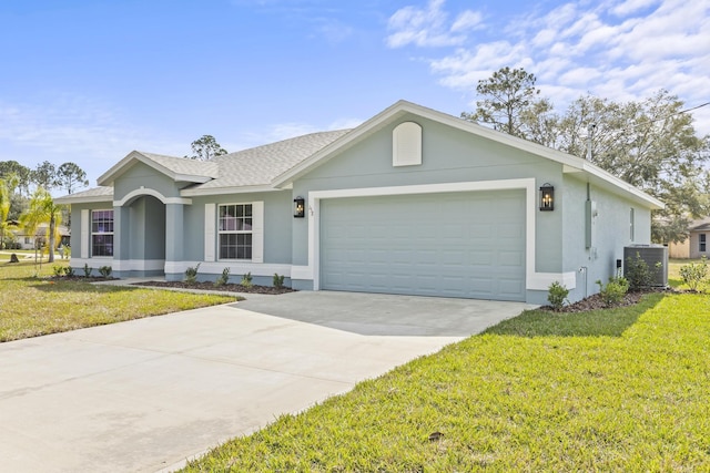 single story home featuring central AC, a garage, and a front lawn