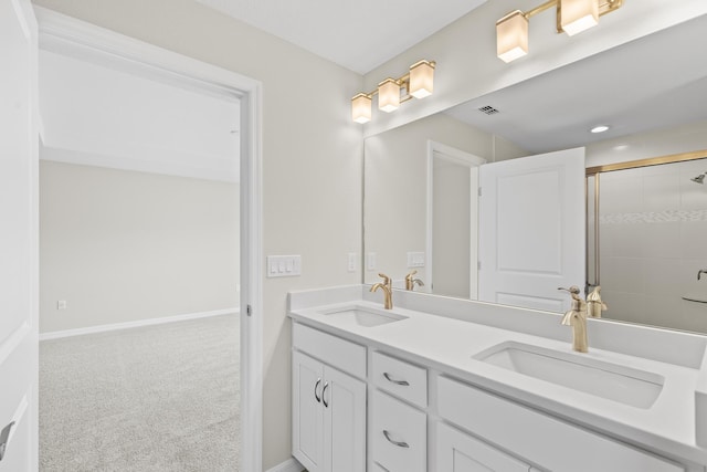 bathroom with vanity and an enclosed shower