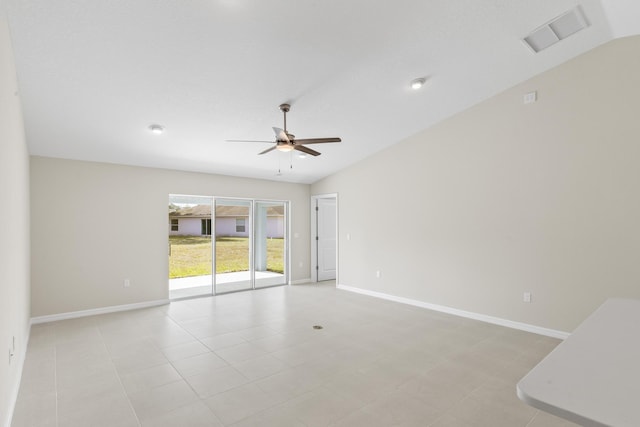 empty room featuring ceiling fan and lofted ceiling