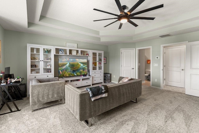 66 Magdaleno Ct, Saint Augustine, FL 32092 - carpeted living room with ceiling fan, a tray ceiling, and baseboards