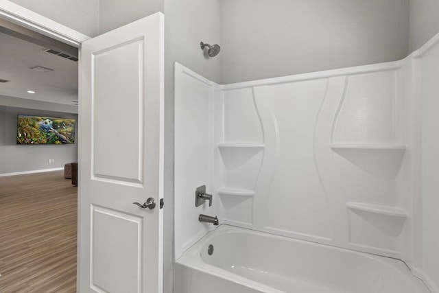 66 Magdaleno Ct, Saint Augustine, FL 32092 - bathroom featuring  shower combination, wood finished floors, and baseboards