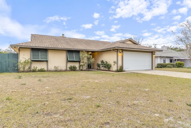 single story home with a garage and a front lawn