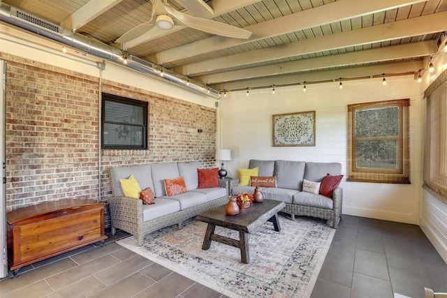 interior space featuring ceiling fan, beam ceiling, wood ceiling, and brick wall