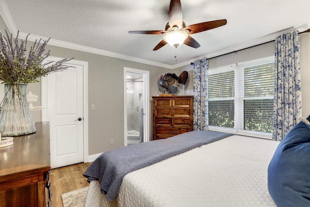 bedroom featuring ensuite bathroom, crown molding, light hardwood / wood-style flooring, ceiling fan, and a textured ceiling