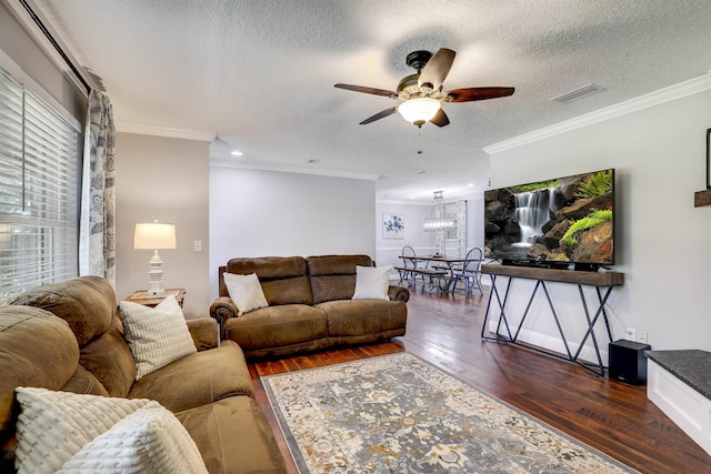 living room featuring dark hardwood / wood-style floors, ceiling fan, and ornamental molding