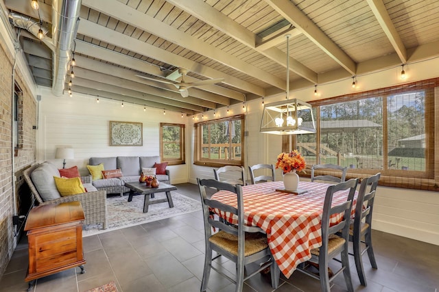 sunroom featuring lofted ceiling with beams, ceiling fan, and wood ceiling