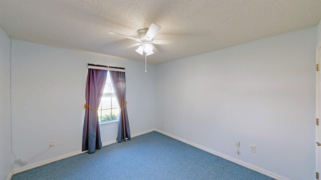 unfurnished room with ceiling fan, carpet, baseboards, and a textured ceiling