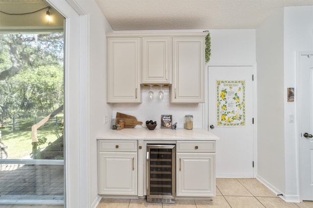 1036 Saltwater Cir, Saint Augustine, FL 32080 - indoor dry bar with beverage cooler, light tile patterned floors, and backsplash