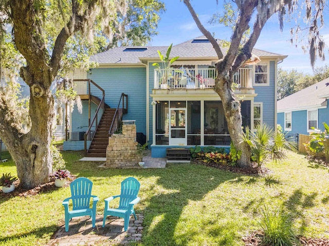 1036 Saltwater Cir, Saint Augustine, FL 32080 - back of property with a sunroom, a balcony, stairway, and a shingled roof