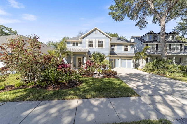 1036 Saltwater Cir, Saint Augustine, FL 32080 - view of front of property featuring concrete driveway, a standing seam roof, a garage, a front lawn, and a metal roof