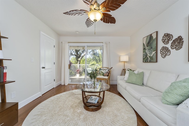 1036 Saltwater Cir, Saint Augustine, FL 32080 - living area featuring a ceiling fan and dark wood-style flooring