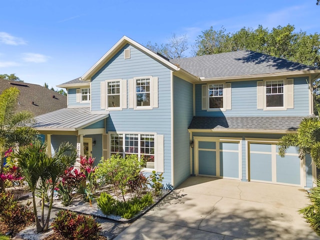 1036 Saltwater Cir, Saint Augustine, FL 32080 - traditional-style home featuring a standing seam roof, concrete driveway, an attached garage, roof with shingles, and a metal roof