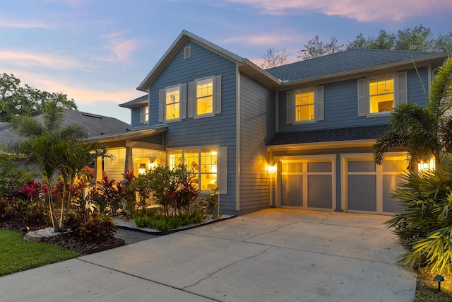 1036 Saltwater Cir, Saint Augustine, FL 32080 - traditional-style house with an attached garage, driveway, and a shingled roof