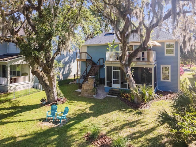 1036 Saltwater Cir, Saint Augustine, FL 32080 - rear view of property featuring a sunroom, a balcony, roof with shingles, and stairs