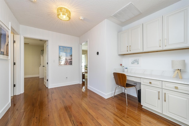 1036 Saltwater Cir, Saint Augustine, FL 32080 - unfurnished office with built in desk and wood finished floors