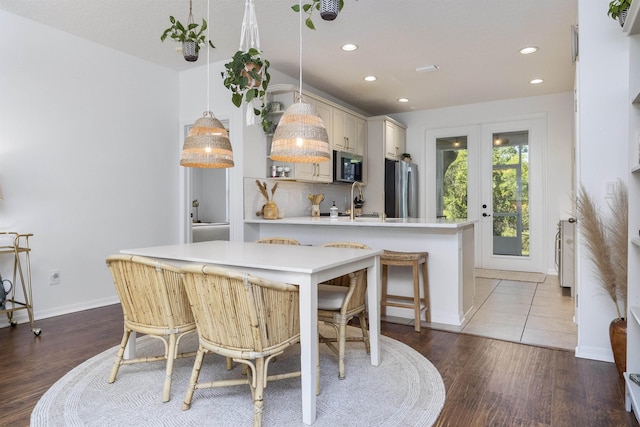 1036 Saltwater Cir, Saint Augustine, FL 32080 - dining area featuring wood finished floors, recessed lighting, and french doors