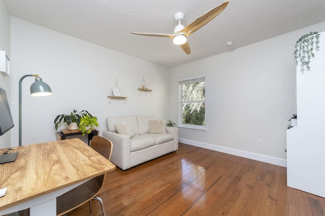 1036 Saltwater Cir, Saint Augustine, FL 32080 - living room featuring ceiling fan, wood-type flooring, and a textured ceiling