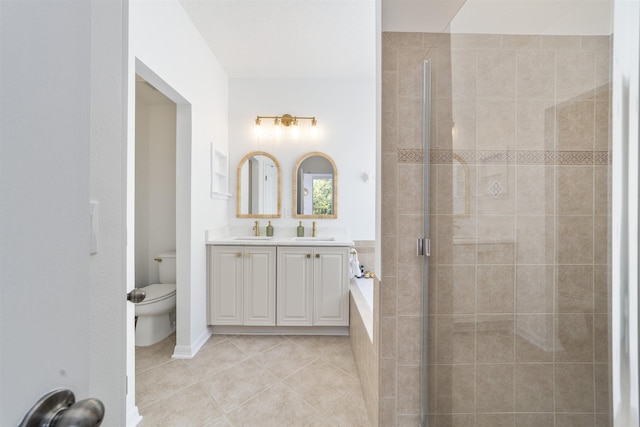1036 Saltwater Cir, Saint Augustine, FL 32080 - full bathroom with double vanity, a stall shower, tile patterned floors, and tiled bath
