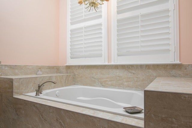 bathroom with tiled tub