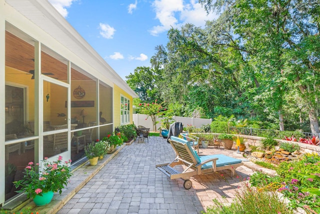 view of patio / terrace featuring a sunroom