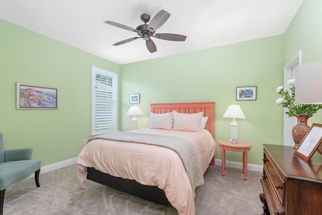 bedroom with light colored carpet and ceiling fan