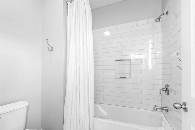 bathroom featuring toilet and shower / bathtub combination with curtain