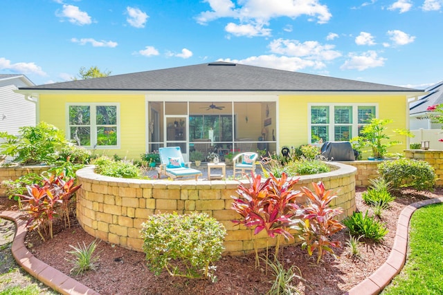 back of property featuring a sunroom