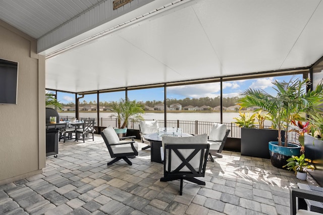 sunroom with a water view