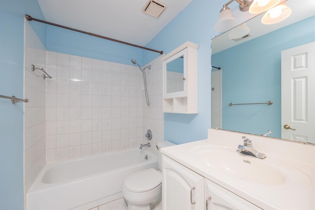 full bathroom with tile patterned flooring, vanity, toilet, and tiled shower / bath