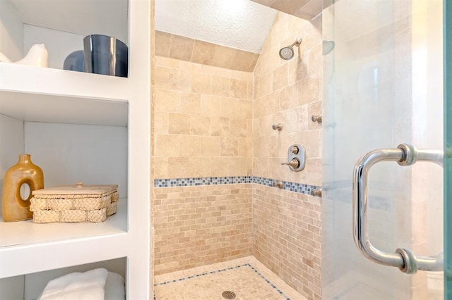 bathroom with a shower with door