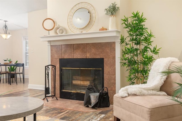 interior space with a tiled fireplace