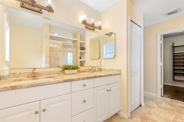 bathroom with vanity and an enclosed shower