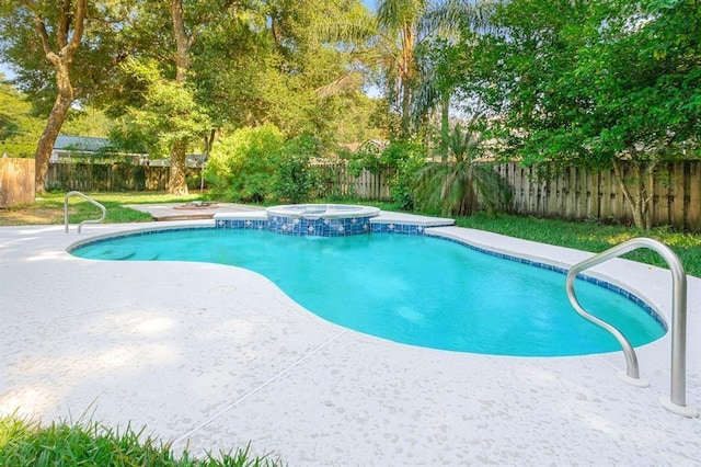 view of swimming pool featuring an in ground hot tub and a patio area