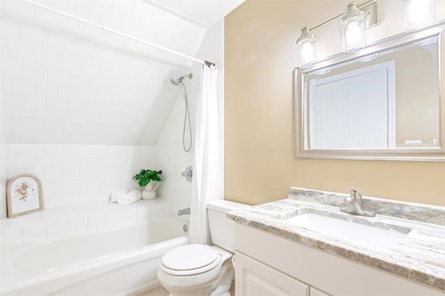 full bathroom featuring vanity, shower / bath combo with shower curtain, and toilet