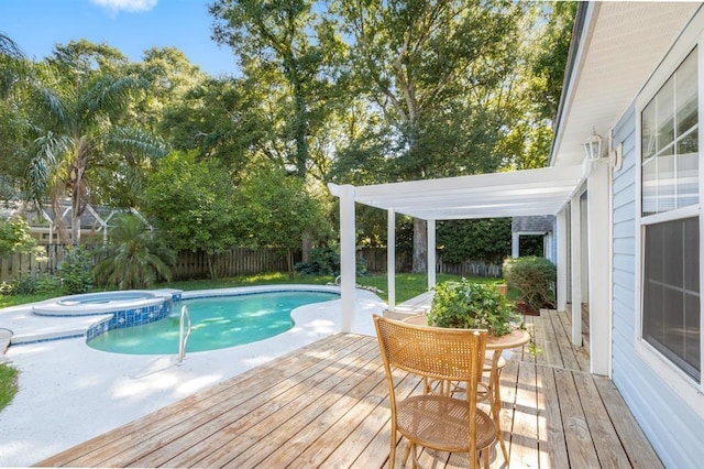 view of pool with a wooden deck, a pergola, and an in ground hot tub