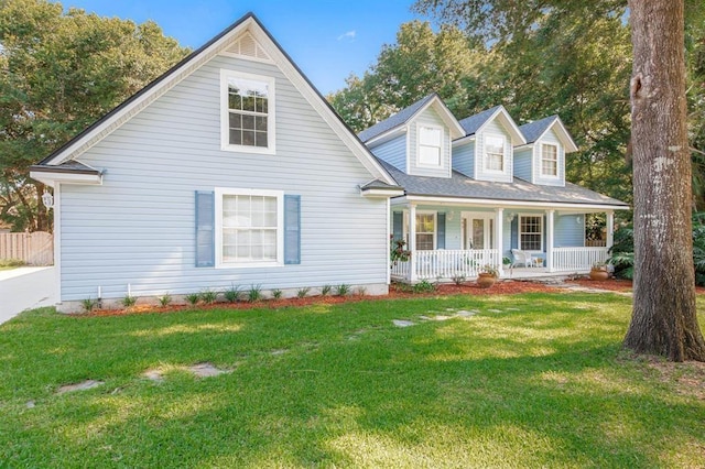 cape cod house featuring a porch and a front lawn