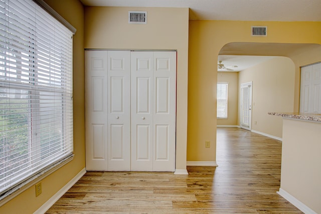 20102 Harbour Vista Cir, Saint Augustine, FL 32080 - unfurnished bedroom with light wood-style floors, arched walkways, and a closet