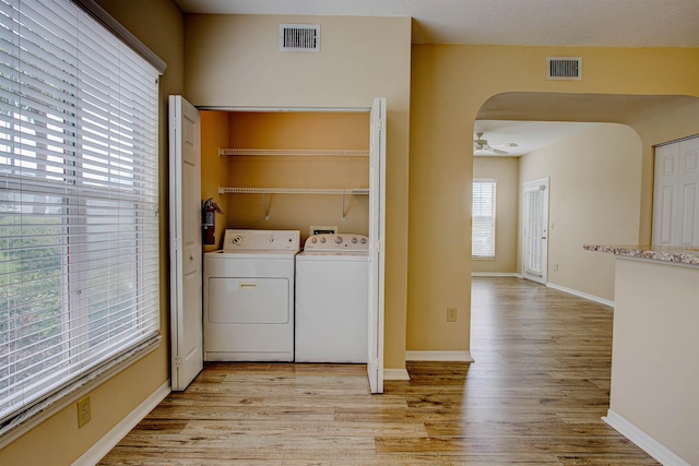 20102 Harbour Vista Cir, Saint Augustine, FL 32080 - laundry room featuring washing machine and clothes dryer, light wood finished floors, and a ceiling fan