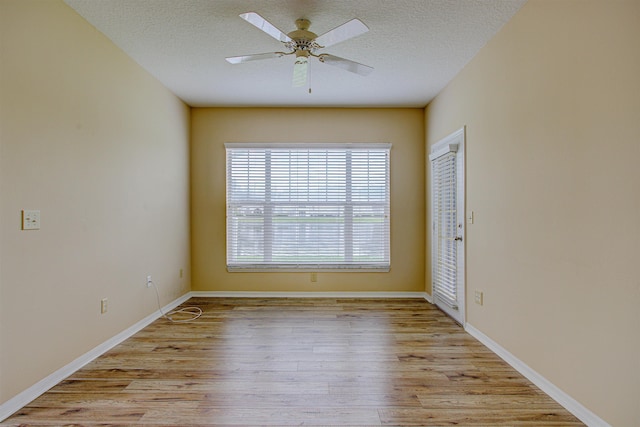 20102 Harbour Vista Cir, Saint Augustine, FL 32080 - unfurnished room featuring light wood-type flooring, a textured ceiling, and ceiling fan