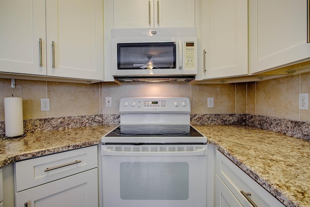 20102 Harbour Vista Cir, Saint Augustine, FL 32080 - kitchen with white appliances, white cabinetry, backsplash, and light stone counters