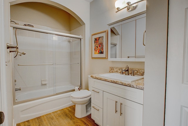 20102 Harbour Vista Cir, Saint Augustine, FL 32080 - bathroom with vanity, enclosed tub / shower combo, and wood finished floors
