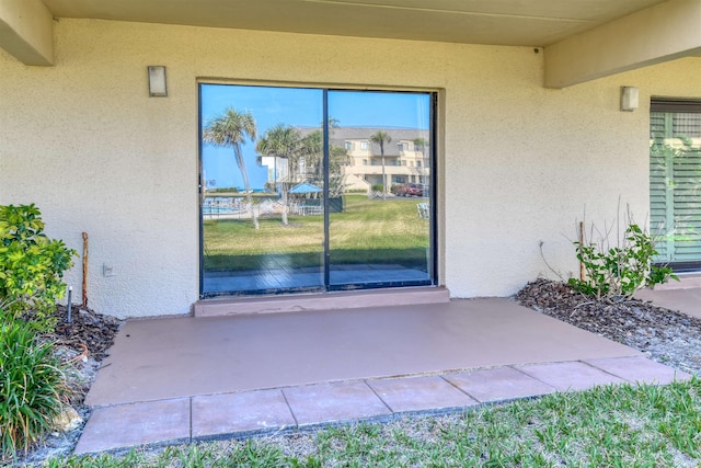 8550 S A1A # 331, Saint Augustine, FL 32080 - view of exterior entry featuring stucco siding