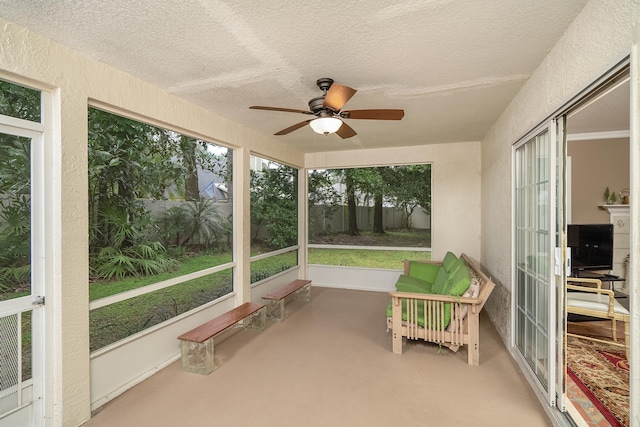 sunroom / solarium with ceiling fan