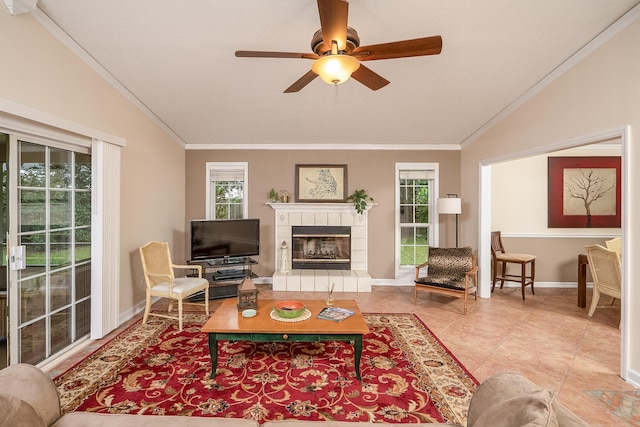 tiled living room featuring vaulted ceiling, ornamental molding, and a tiled fireplace