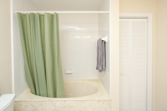 bathroom with toilet and shower / bathtub combination with curtain