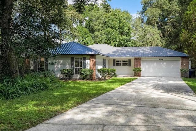 ranch-style home with a front lawn and a garage